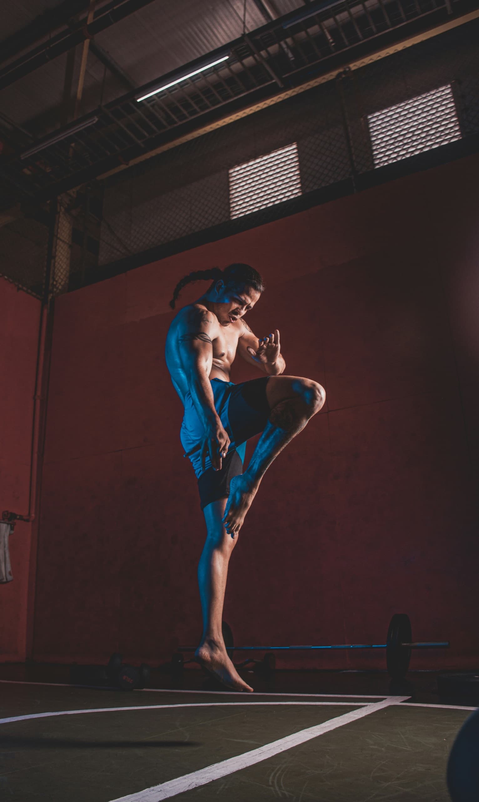 A student drilling strikes on a heavy bag